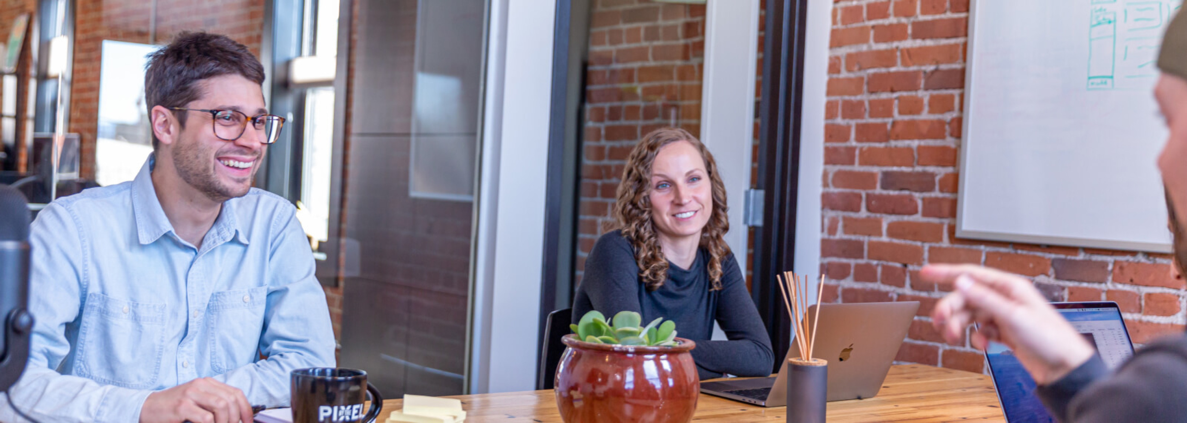 People talking around a table and working together as partners